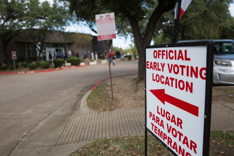 Voters line up outside the Oak Cliff Sub-Courthouse in Dallas, Texas, for the first day of early voting on Monday, Oct. 24, 2016.